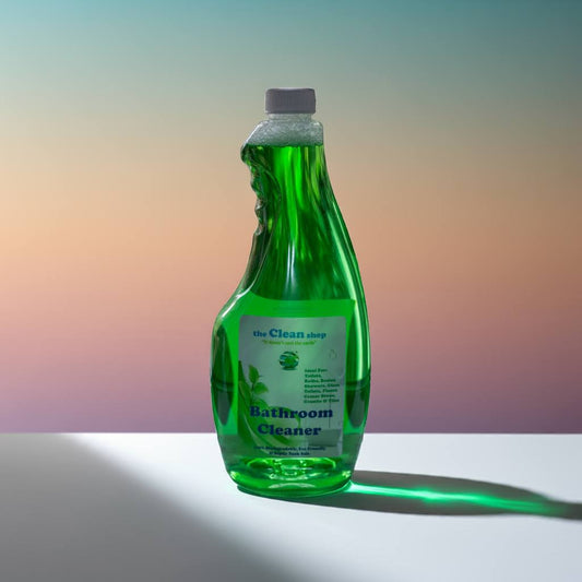 Green bottle of bathroom cleaner on a gradient background