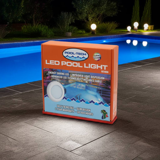 Pool-Tech LED pool light packaging by a pool at night