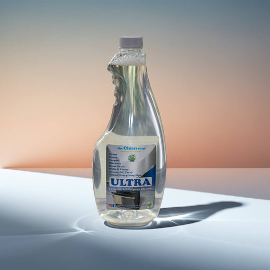 Bottle of Ultra cleaning solution on a reflective surface with a gradient background